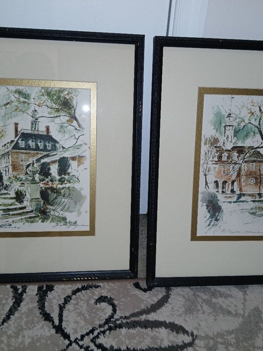 A pair of matching framed watercolor prints by John Haymson